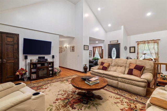 living room featuring recessed lighting, wood finished floors, and high vaulted ceiling