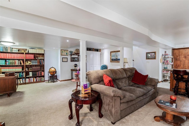 carpeted living area featuring baseboards