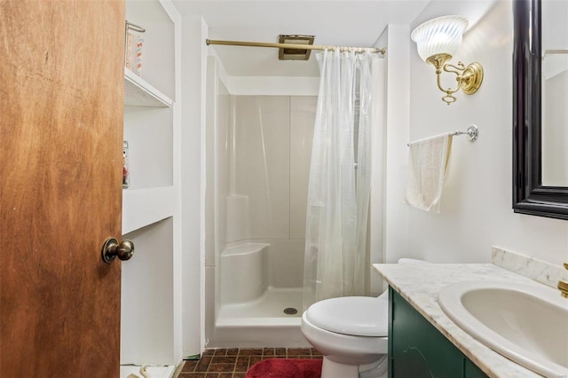 bathroom featuring vanity, a shower with shower curtain, and toilet