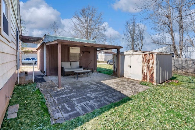 view of patio / terrace with a shed, an outdoor structure, and fence