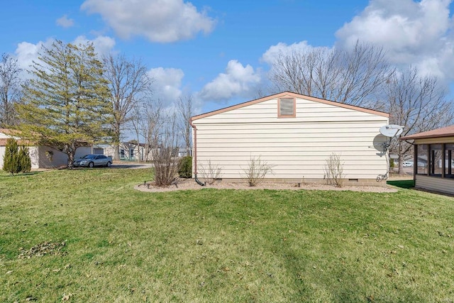 view of home's exterior with crawl space and a lawn