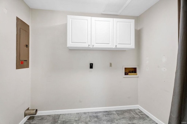 washroom featuring electric panel, baseboards, cabinet space, and washer hookup