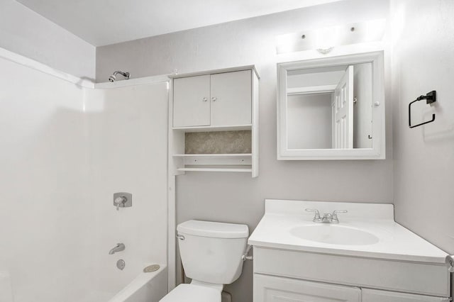 bathroom with tub / shower combination, toilet, and vanity