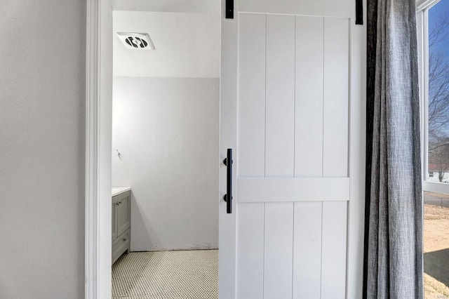 bathroom with vanity and visible vents