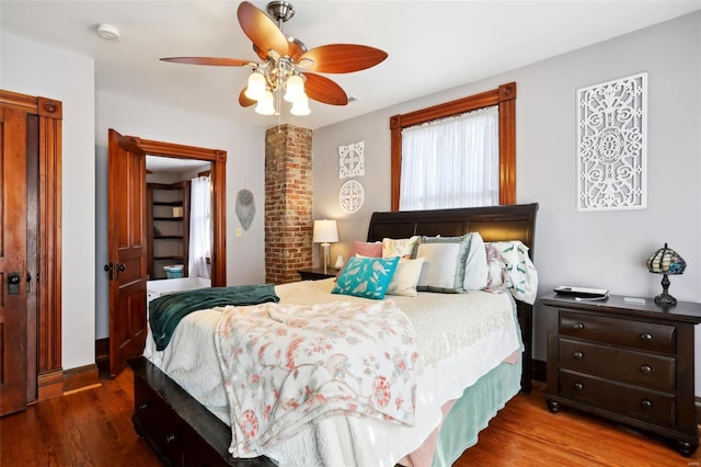 bedroom with a ceiling fan and wood finished floors