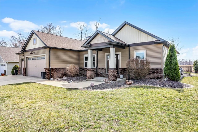 view of front of house with driveway, brick siding, a front lawn, a garage, and board and batten siding