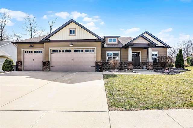 craftsman-style home with brick siding, driveway, an attached garage, and a front yard