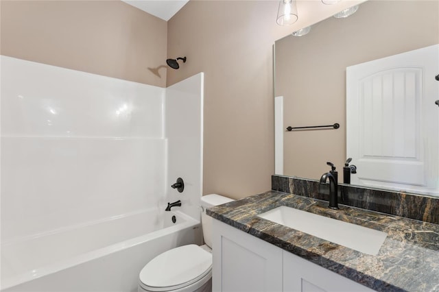 bathroom featuring vanity, toilet, and shower / bathtub combination