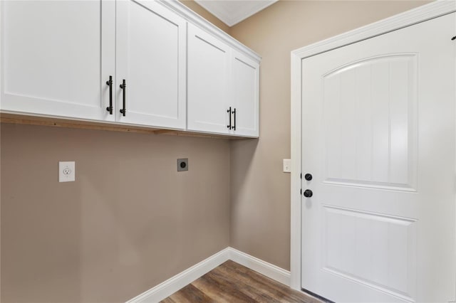 laundry area with cabinet space, baseboards, dark wood-style flooring, and electric dryer hookup