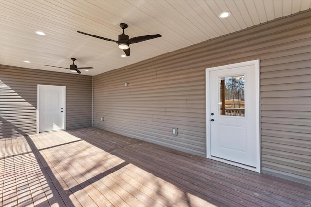 wooden terrace with a ceiling fan