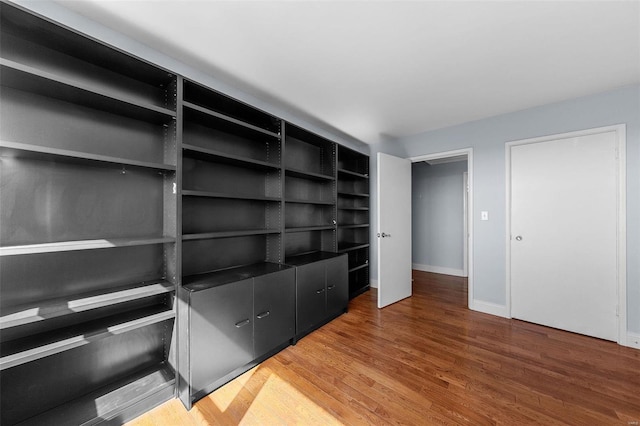 walk in closet featuring light wood finished floors