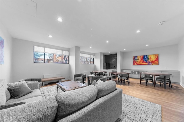 living room with recessed lighting and light wood finished floors