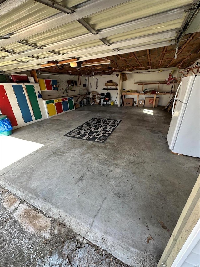 garage with freestanding refrigerator