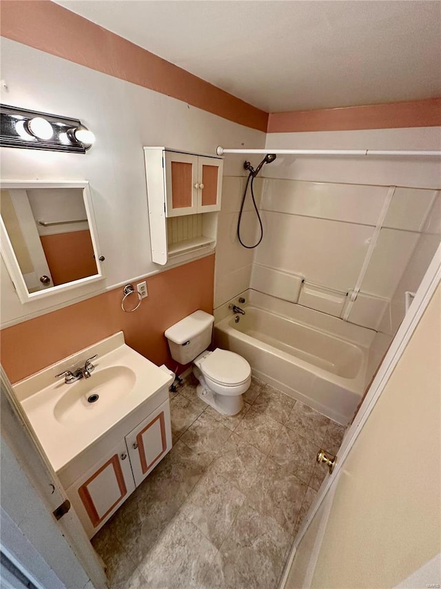 bathroom with vanity, toilet, and washtub / shower combination