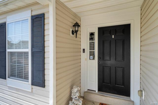 doorway to property featuring a porch