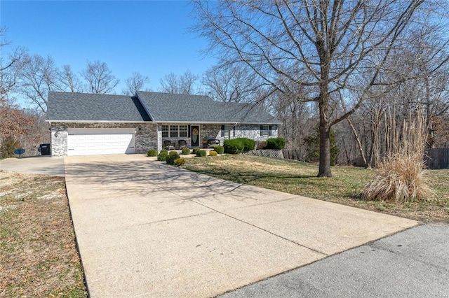 ranch-style home featuring stone siding, covered porch, concrete driveway, a front yard, and a garage