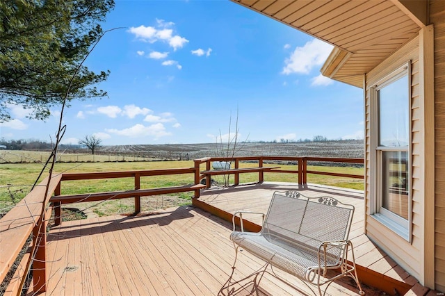 wooden terrace featuring a rural view