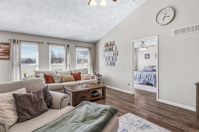 living area featuring visible vents, a healthy amount of sunlight, and ceiling fan