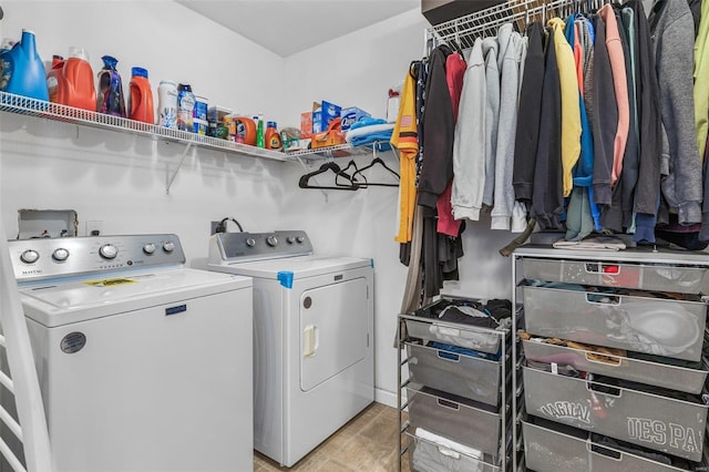 clothes washing area with washer and dryer and laundry area