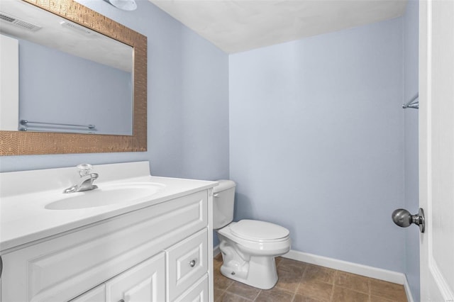 bathroom with visible vents, baseboards, toilet, and vanity