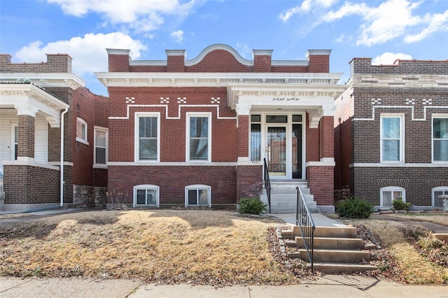 view of front facade featuring brick siding