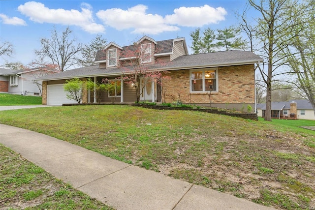 view of front of house with a garage, a front lawn, brick siding, and concrete driveway