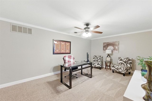office featuring ornamental molding, light colored carpet, a ceiling fan, and baseboards