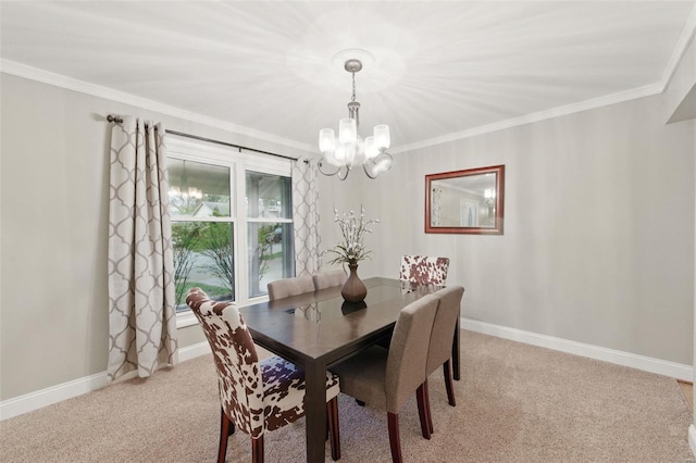 dining area with a chandelier, light colored carpet, ornamental molding, and baseboards
