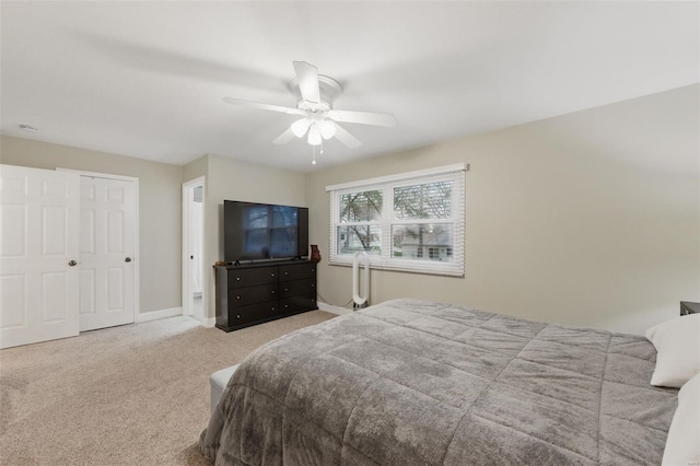 bedroom featuring carpet, a ceiling fan, and baseboards