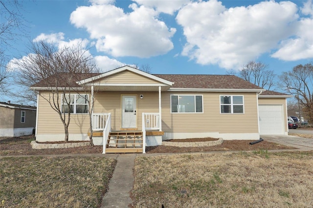 view of front of property featuring a front lawn, a porch, concrete driveway, roof with shingles, and an attached garage