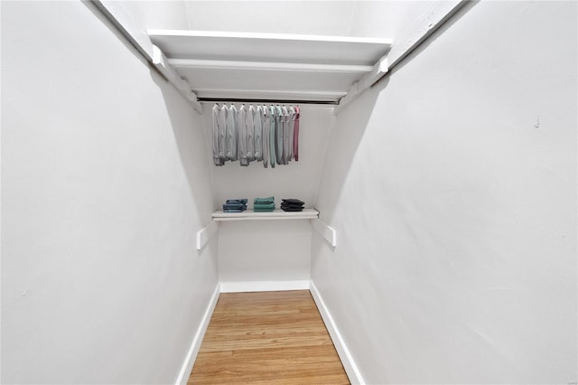 spacious closet with wood finished floors