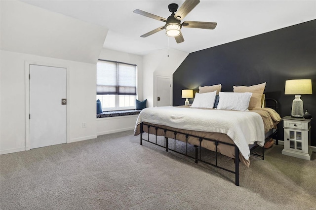 carpeted bedroom with a ceiling fan and baseboards