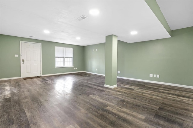 interior space with recessed lighting, dark wood-style floors, visible vents, and baseboards