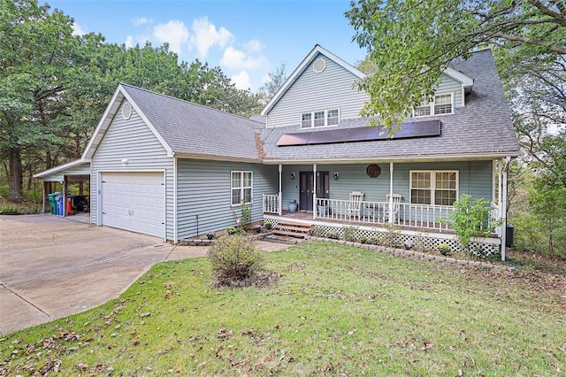 view of front of property featuring a front lawn, a porch, roof with shingles, a garage, and solar panels