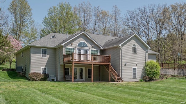 rear view of house featuring stairway, a wooden deck, cooling unit, french doors, and a yard