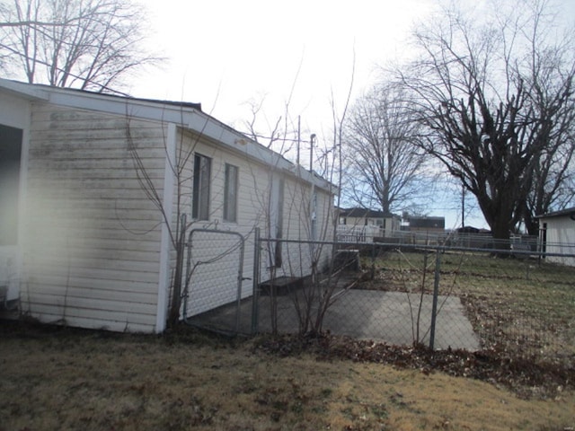 view of side of property with fence