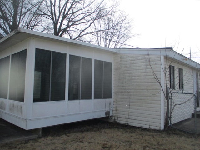 view of side of property with a sunroom