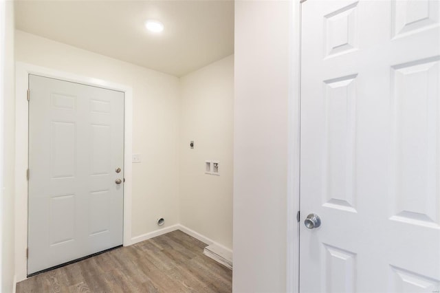 laundry room featuring baseboards, washer hookup, laundry area, light wood-style floors, and hookup for an electric dryer