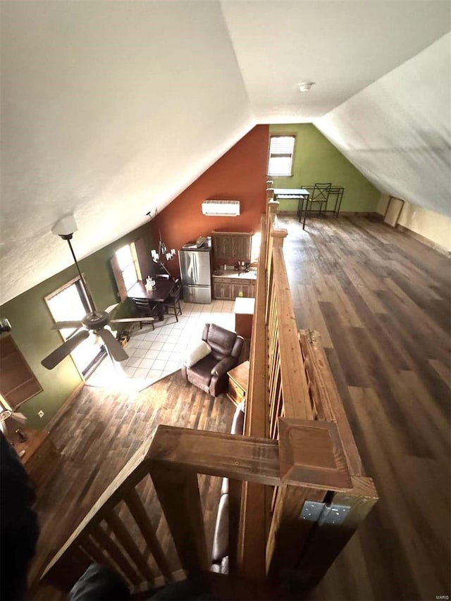 bonus room featuring vaulted ceiling, wood finished floors, and ceiling fan