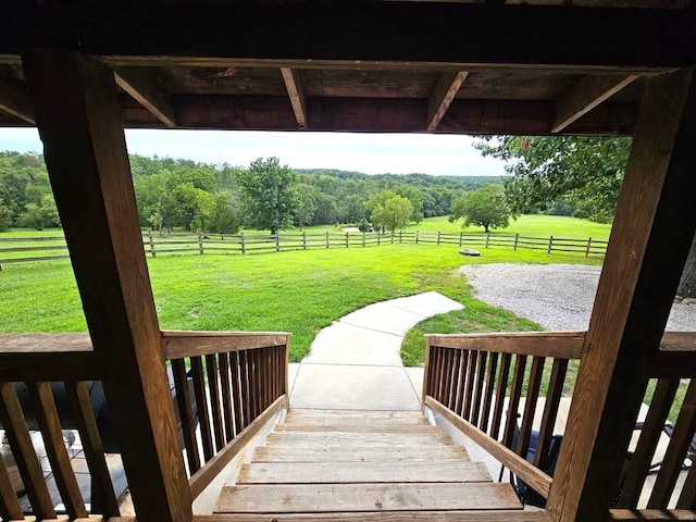 surrounding community featuring a rural view and a yard