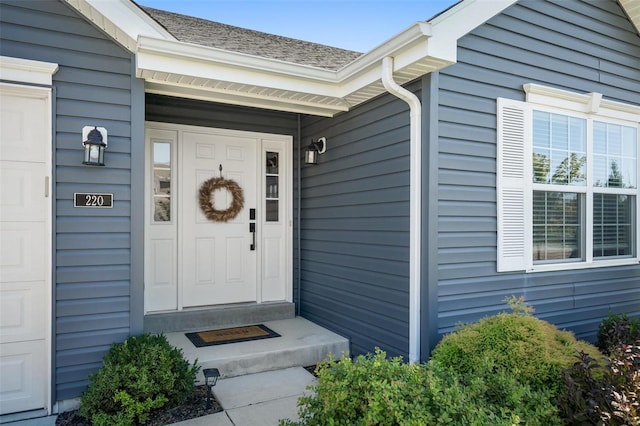 doorway to property featuring a garage