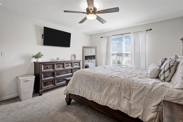 bedroom with baseboards, carpet, and a ceiling fan