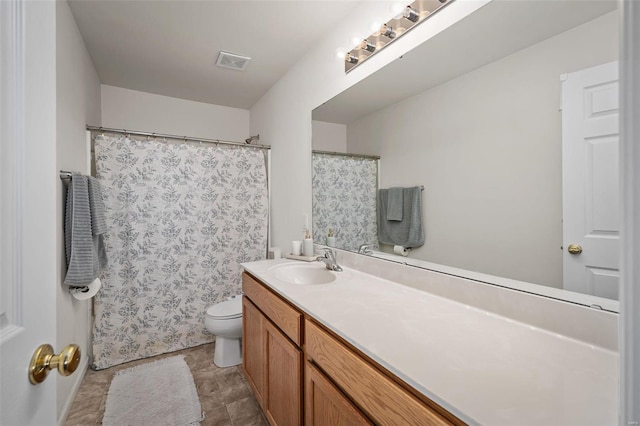 full bath featuring visible vents, toilet, and vanity