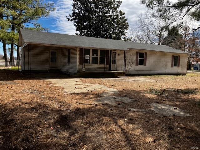 rear view of house with entry steps