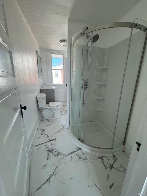 full bath featuring baseboards, toilet, marble finish floor, and a stall shower