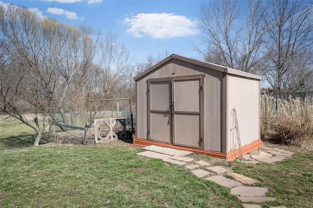 view of shed featuring fence