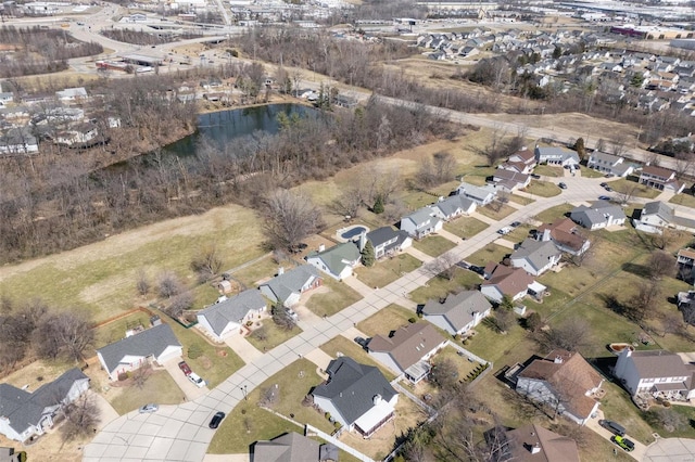 birds eye view of property with a residential view and a water view