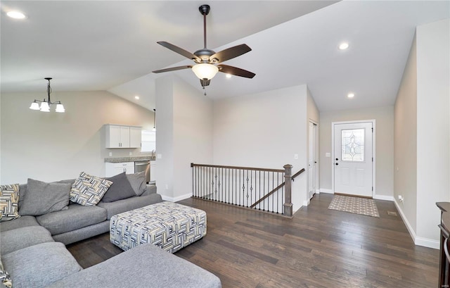 living room with vaulted ceiling, recessed lighting, wood finished floors, and baseboards