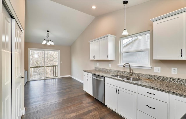 kitchen featuring light stone countertops, vaulted ceiling, dark wood-style flooring, stainless steel dishwasher, and a sink