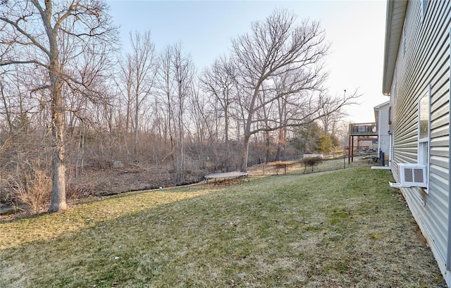 view of yard featuring cooling unit and fence